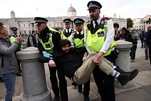 Police officers detain a protester during a mass demonstration organised by Defend our Juries, against the British government's ban on Palestine Action, in London, Britain, October 4, 2025. REUTERS/Jack Taylor