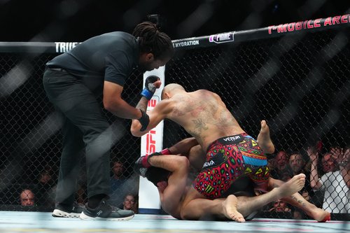 Oct 4, 2025; Las Vegas, Nevada, UNITED STATES; Magomed Ankalaev (red gloves) fights Alex Pereira (blue gloves) during UFC 320 at T-Mobile Arena. Mandatory Credit: Stephen R. Sylvanie-Imagn Images