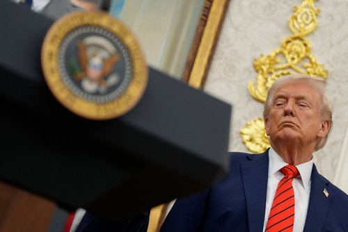 U.S. President Donald Trump listens during an announcement about lowering U.S. drug prices, at the White House in Washington, D.C., U.S., October 10, 2025. REUTERS/Kent Nishimura