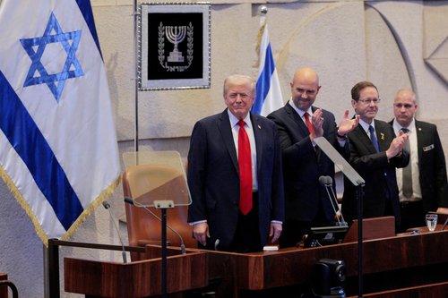 JERUSALEM - OCTOBER 13: U.S. President Donald Trump arrives to address the Knesset, with Amir Ohana, Speaker of the Israeli Knesset, and Israeli President Isaac Herzog on October 13, 2025 in Jerusalem. Chip Somodevilla/Pool via REUTERS