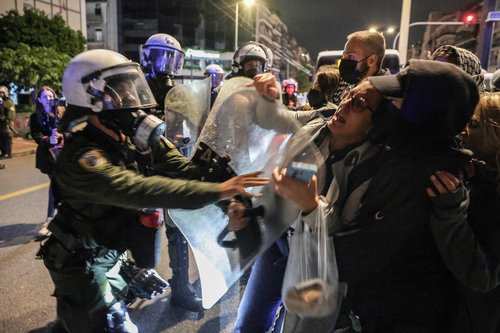 Pro-Palestinian protesters clash with police officers during a demonstration near the Israeli embassy on the two-year anniversary of the deadly October 7, 2023 attack