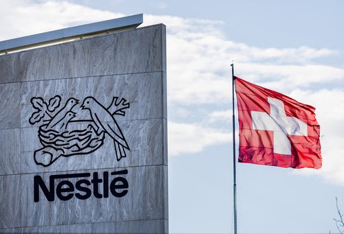 FILE PHOTO: FA Swiss flag flutters on the headquarters of Nestle in Vevey, Switzerland, November 25, 2024. REUTERS/Denis Balibouse/File Photo