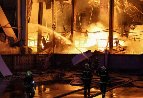Firefighters work at the site of food warehouses hit by an overnight Russian missile strike, amid Russia’s attack on Ukraine, in Kyiv, Ukraine October 25, 2025. REUTERS/Yan Dobronosov