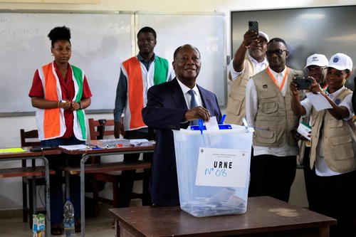 Ivory Coast's President Alassane Ouattara, who is seeking a fourth term, votes during the presidential election