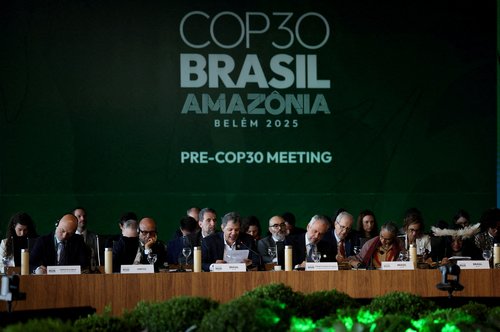 FILE PHOTO: FILE PHOTO: Brazil's Finance Minister Fernando Haddad speaks next to Simon Stiell, Executive Secretary of UN Climate Change (UNFCCC),