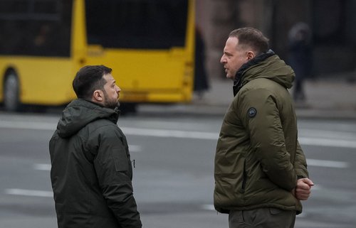 Ukraine's President Volodymyr Zelenskiy speaks with Head of the Presidential Office Andriy Yermak as they wait for German Chancellor Olaf Scholz at the Independence Square