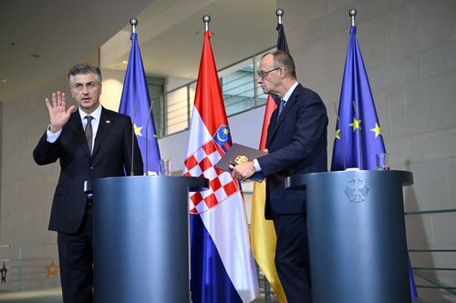 Croatian Prime Minister Andrej Plenkovic gestures at the end of a press conference with German Chancellor Friedrich Merz at the Chancellery in Berlin