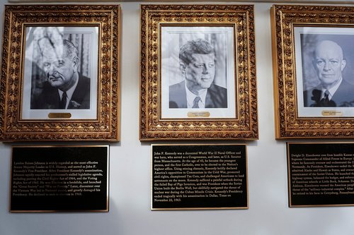 Portraits and plaques dedicated to former U.S. Presidents Lyndon B. Johnson, John F. Kennedy and Dwight D. Eisenhower at the "Presidential Walk of Fame" at the White House, in Washington, D.C., U.S., December 17, 2025. REUTERS/Aaron Schwartz