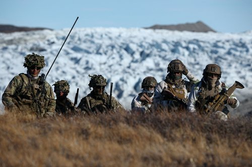 Members of the Danish armed forces practice looking for potential threats during a military drill as Danish, Swedish and Norwegian home guard units together with Danish, German and French troops take part in joint military drills
