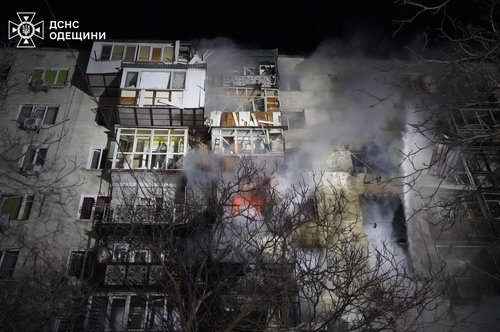 Smoke rises from an apartment building damaged during an overnight Russian drone strike, amid Russia's attack on Ukraine, in Odesa, Ukraine, December 31, 2025.