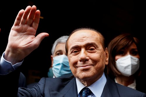 FILE PHOTO: Berlusconi arrives at Montecitorio Palace for talks on forming a new government, in Rome