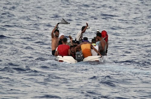 Migrants navigate to the Italian island of Lampedusa