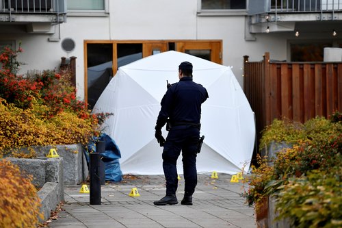 Police forensics work at the site where Swedish rapper Einar was reportedly shot dead, in Stockholm