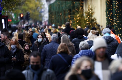 People walk past a Selfridge's store on Oxford Street, amid the COVID-19 outbreak in London