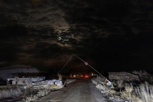 A service member of the Ukrainian armed forces opens the gate of an airfield near Stanytsia Luhanska, in the Luhansk region, Ukraine