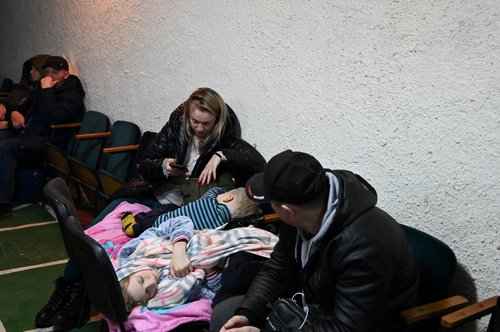 People gather in an air raid shelter in Kyiv