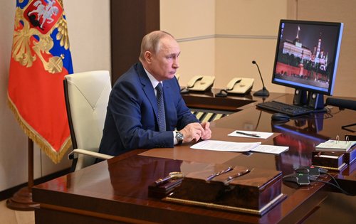 Russian President Putin takes part in a video link outside Moscow