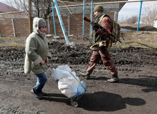 People receive humanitarian aid in the Donetsk region