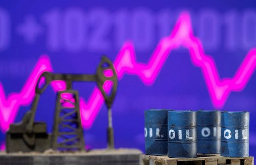 FILE PHOTO: FILE PHOTO: Models of oil barrels and a pump jack are displayed in front of a rising stock graph and "$100" in this illustration