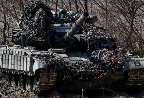 A Ukrainian tank is seen at a position on the front line in the east Kyiv region