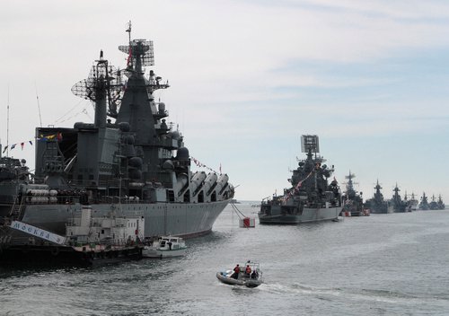 FILE PHOTO: Russian Navy vessels are anchored in a bay of the Black Sea port of Sevastopol