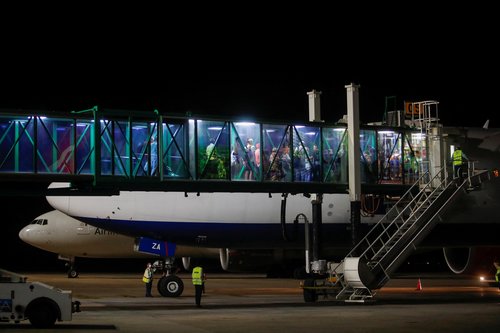 Russian nationals board an airplane before a flight to Russia, in Varadero