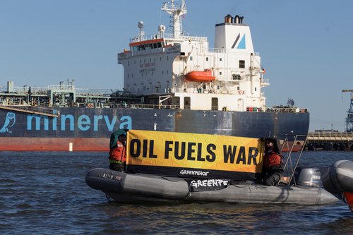 Activists protest near Oil tanker Minerva Virgo docked at the Bayonne New Jersey