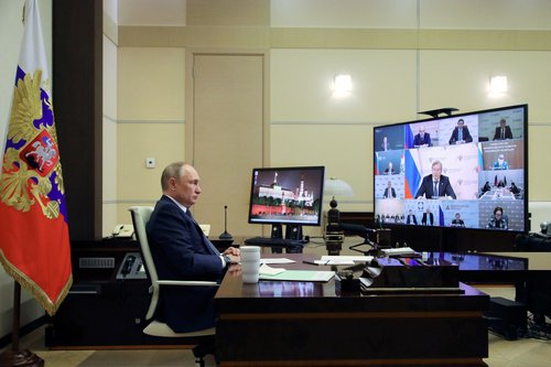 Russian President Vladimir Putin chairs a meeting outside Moscow