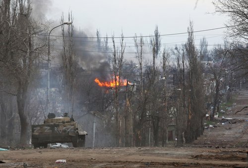 An armoured vehicle of pro-Russian troops is seen in the street in Mariupol