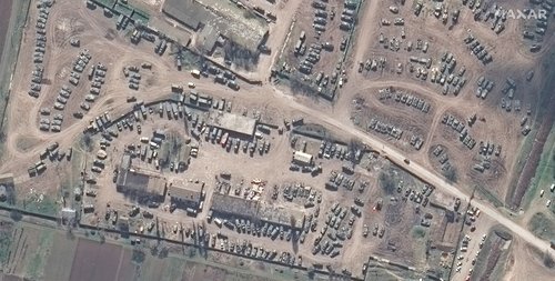 A satellite image shows a closer view of assortment of armored vehicle in Dzhankoy