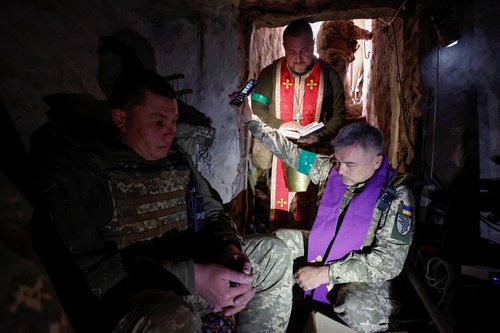 Ukrainian servicemen celebrate an Orthodox Easter at positions in Kharkiv region