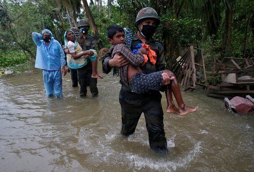 FILE PHOTO: Army soldiers evacuate people from a flooded area to safer places as Cyclone Yaas makes landfall at Ramnagar