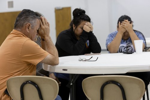 People react at a vigil after a mass shooting at Robb Elementary School in Uvalde