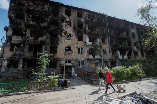 A view shows a damaged building in Mariupol