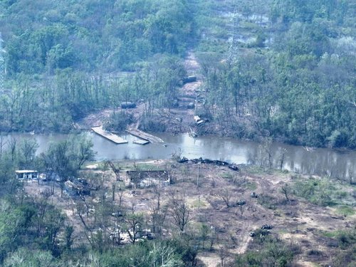 FILE PHOTO: An aerial view of burnt vehicles across the Siverskyi Donets River