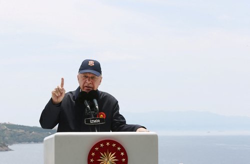 Turkish President Tayyip Erdogan addresses the audience as he watches a military exercise near Izmir