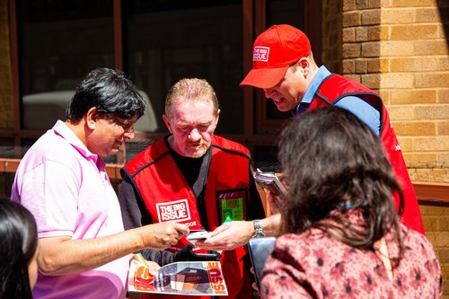 Britain's Prince William works as a vendor of The Big Issue newspaper