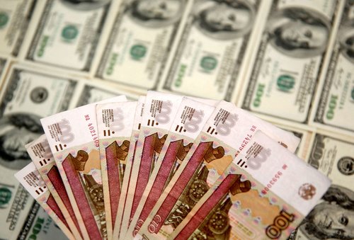FILE PHOTO: A picture illustration shows U.S. Dollar and Russian Ruble banknotes in Sarajevo