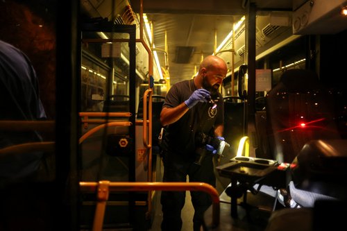 An Israeli police officer checks a bus following an incident in Jerusalem