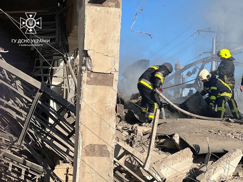 Firefighters work to put out a fire at energy infrastructure facilities, damaged by a Russian missile strike in Kyiv region in Ukraine