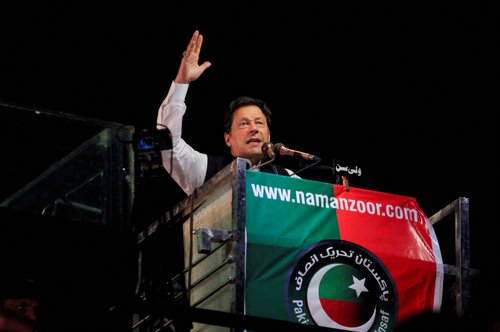 FILE PHOTO: Ousted Pakistani Prime Minister Imran Khan gestures as he addresses supporters during a rally, in Lahore