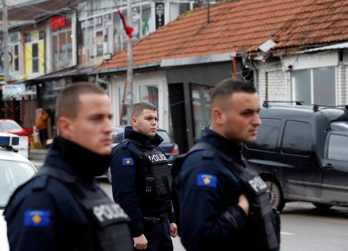 Kosovo police officers patrol in ethnically mixed area in North Mitrovica