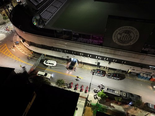 A hearse carrying the body of Brazilian soccer legend Pele arrives at the Vila Belmiro stadium in Santos