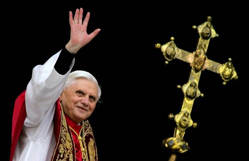 FILE PHOTO: Pope Benedict XVI, Cardinal Joseph Ratzinger of Germany, waves from a balcony of St. Peter's Basilic..