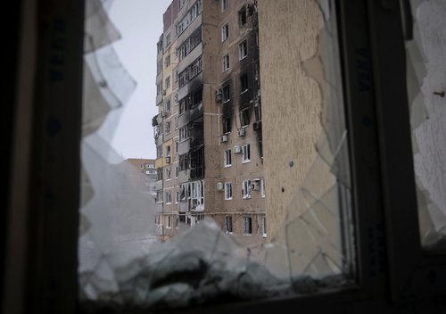 A building damaged by a Russian military strike is seen in the front line city of Vuhledar