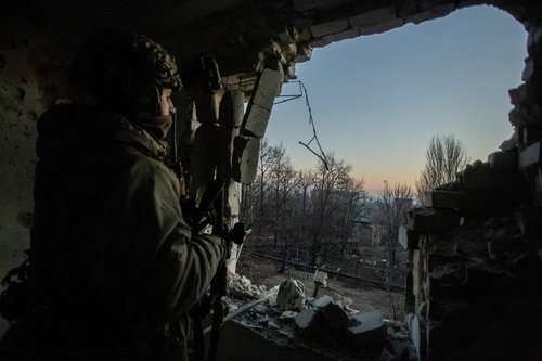 FILE PHOTO: A Ukrainian serviceman looks on in Bakhmut