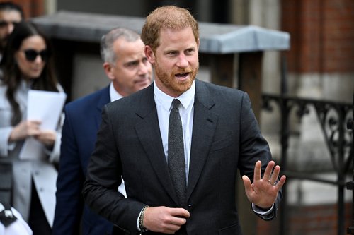 Britain's Prince Harry walks outside the High Court, in London