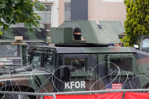 FILE PHOTO: Members of the NATO-led Kosovo Force (KFOR) stand guard in Leposavic