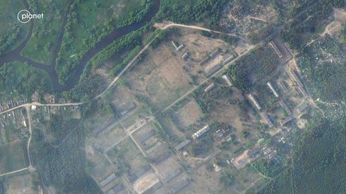 A satellite image appears to show the area before the setting up of new facilities, at a military base in Tsel