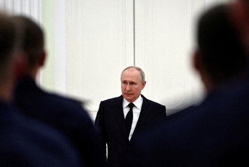 FILE PHOTO: Russian President Putin meets service members in Moscow